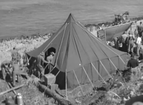KISKA, ALASKA - 1943: Camp — a pyramidal tent pitched on the gravel Video stock 343135425