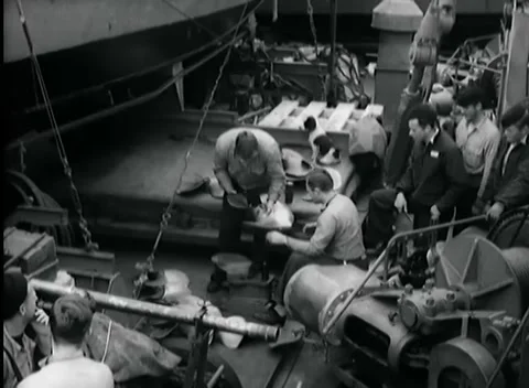 KISKA, ALASKA - 1943: Deck Hoisting Work - Crew Gathers at Hoisting Line Stock Footage 343788633