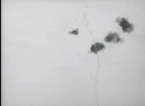 KISKA, ALASKA - 1943: Shell Burst Pattern - Diagonal Flak Line in Sky Stock Footage 343788601