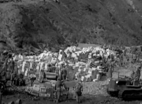 KISKA, ALASKA - 1943: Supply dump — a tractor working through the stores Video stock 343135422