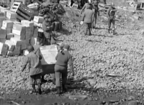 KISKA, ALASKA - 1943: Supply dump — stores carried across the shingle Video stock 343135426