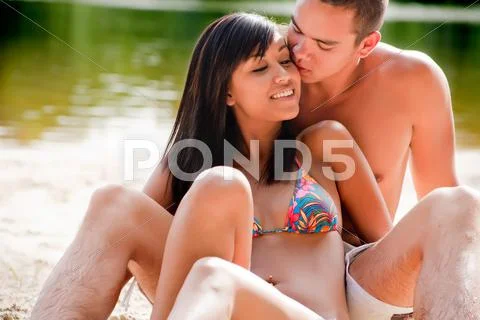 Kiss the bikini babe Stock Photos