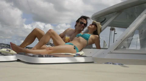 Kissing couple on catamaran Stock Footage