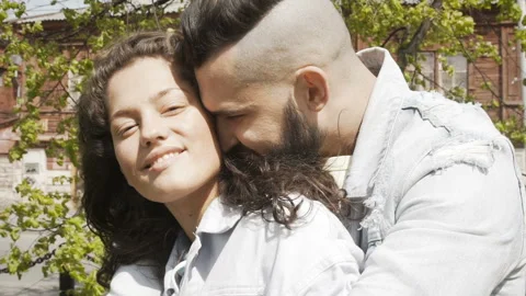 Kissing young couple in bright sunlight Stock Footage 95134053