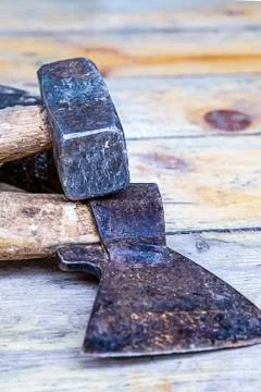 The kit includes an old sledgehammer and an ax used in construction and repai Stock Photos