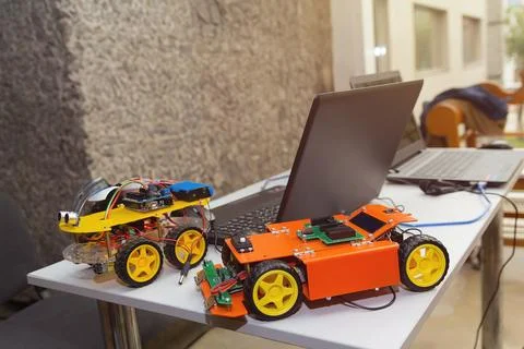 Kit models and laptops on the table on robotics Stock Photos