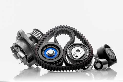 Kit of timing belt with rollers on a white background Фото