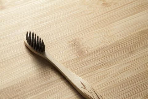 Kit of toothbrushes on the rustic wooden table in the bathroom. Warm and welc Stock Photos