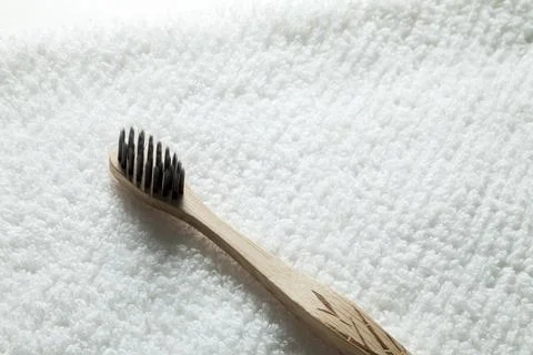 Kit of toothbrushes on the rustic wooden table in the bathroom. Warm and welc Foto stock