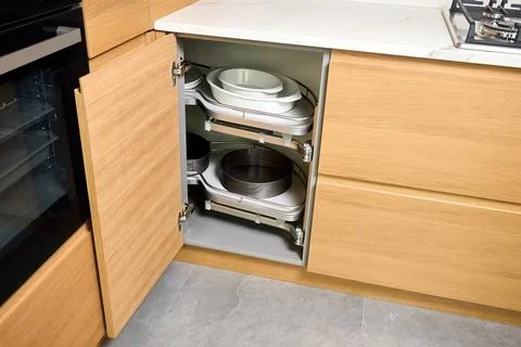 Kitchen access mechanism Magic corner for Blind Corner Cabinets pushed inside Stock Photos