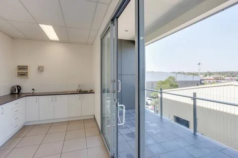 Kitchen adjacent to a balcony Stock Photos
