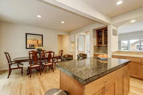 Kitchen and dining room interior with hardwood floor. Close up of kitchen isl Stock Photos