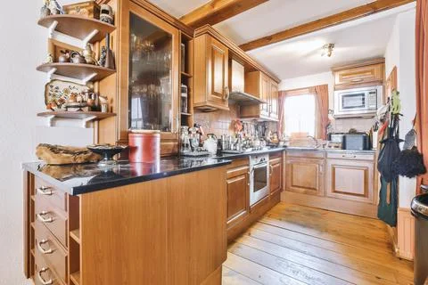 Kitchen and dining zone in modern apartment Stock Photos