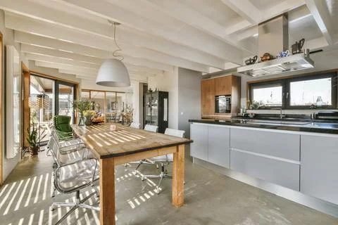 Kitchen and dining zone in studio apartment Stock Photos
