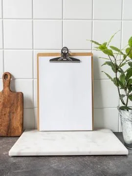 Kitchen background with clipboard with blank sheet for text Stock Photos