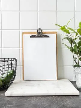 Kitchen background with clipboard with blank sheet for text Stock Photos