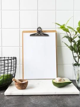 Kitchen background with clipboard with blank sheet for text Stock Photos