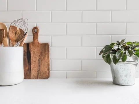 Kitchen background with kitchen utensils and houseplant Stock Photos