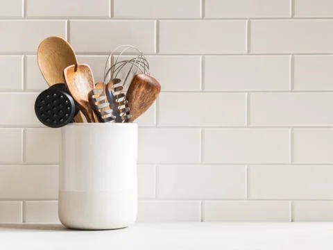 Kitchen background with kitchen utensils in ceramic jar Stock Photos