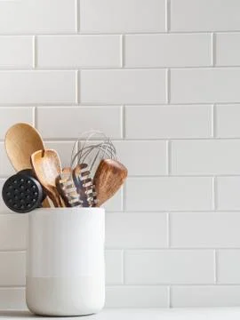 Kitchen background with kitchen utensils in ceramic jar Stock Photos