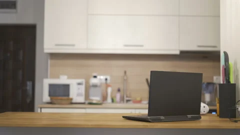 Kitchen background with table and laptop with copy space concept Video stock 141925237