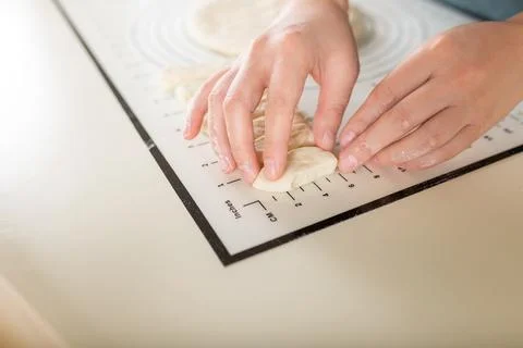Kitchen baking mat with inch and metric markings for ease of use during the Stock Photos