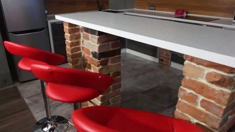 Kitchen with bar counter and red chairs Stock Footage 153803569