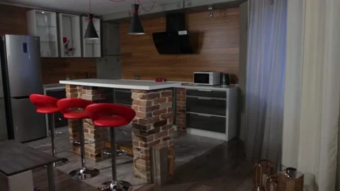 Kitchen with bar counter and red chairs Stock Footage 153803615