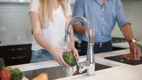 On the Kitchen Beautiful Couple Makes Breakfasts. Guy Impresses His Lady By Stock Footage 101850862