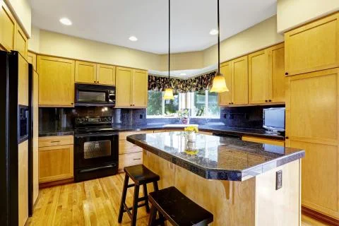Kitchen with black appliances Stock Photos