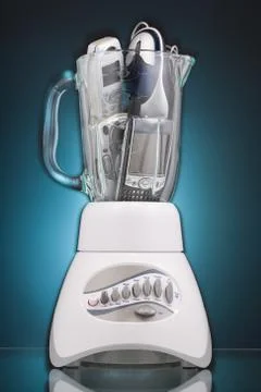 Kitchen blender filled with consumer electronics Foto stock