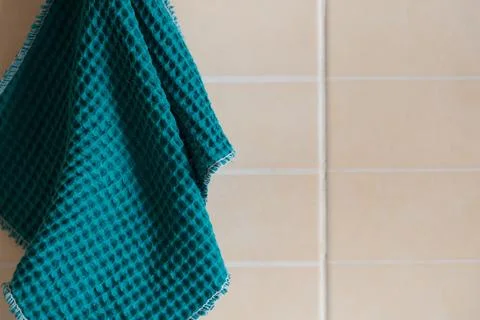 Kitchen blue waffle towel hanging on the wall Stock Photos