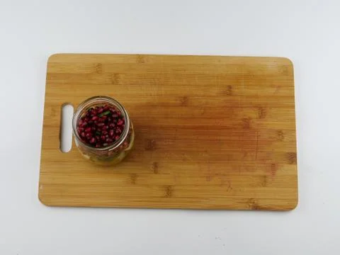Kitchen Board cooking vegetable salad leaf cheese nut pomegranate oil Stock Photos