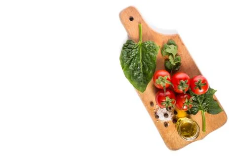 Kitchen board with vegetables Stock Photos