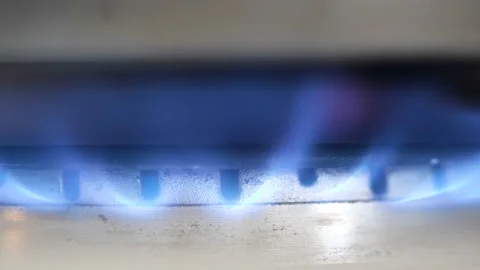 Kitchen burner gas stove clear blue flame burning slow motion, object macro Stock Footage