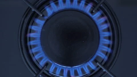 Kitchen burner turning on.Stove top burner igniting into a blue cooking flame. Stock Footage