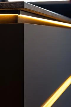 Kitchen cabinet with LED lighting dark front modern style. Atmospheric mini.. Stock-Fotos