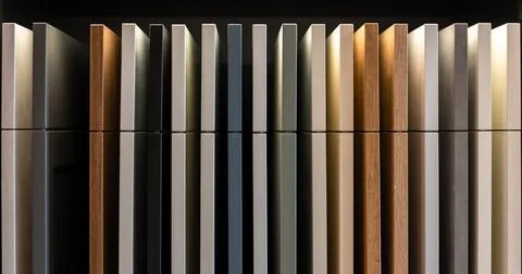 Kitchen cabinet samples with reflection on dark surface. Modern furniture m.. Stock Photos