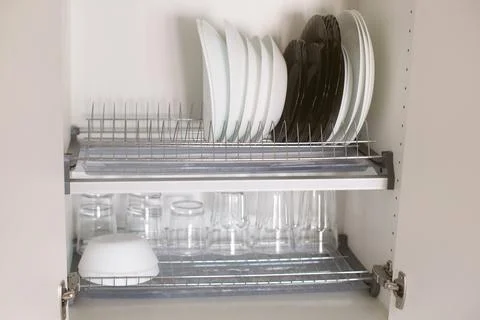 Kitchen cabinet storage idea. Stock Photos