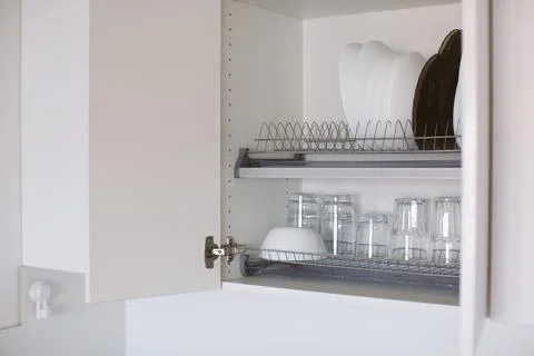 Kitchen cabinet storage idea. Stock Photos