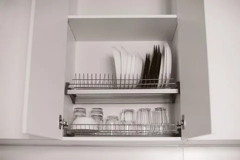 Kitchen cabinet storage idea. Stock Photos