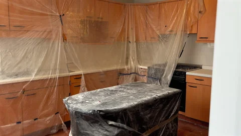 Kitchen Cabinets And Island Covered With Plastic Sheets During Renovation. - Stock Footage 306951672