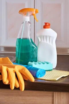 Kitchen care kit: protective gloves, detergent, napkin, garbage bags. Close-u Stock Photos