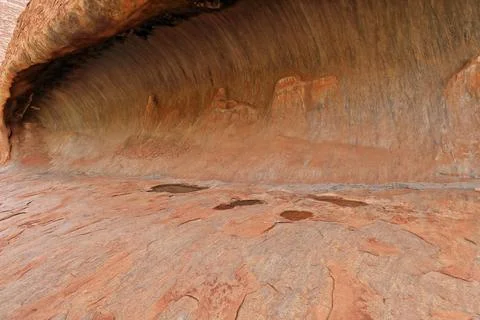 Kitchen Cave on the wall of Uluru-Ayers Rock seen from the base walk. NT-AUS Stock Photos