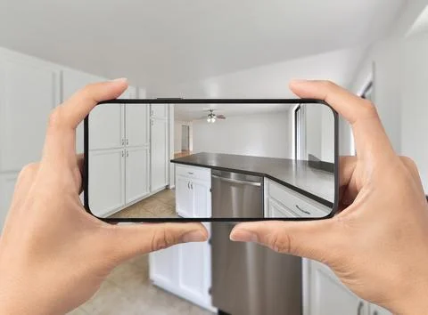 Kitchen with cell phone Stock Photos
