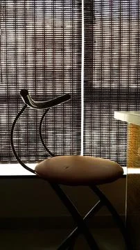 The kitchen chair next to the table, which is taken as anti-light and silhouette Stock Photos