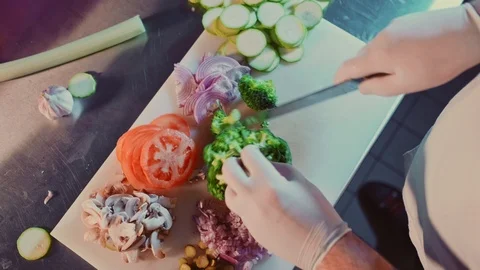 Kitchen chef cutting broccoli with a knife Stock Footage 104200319