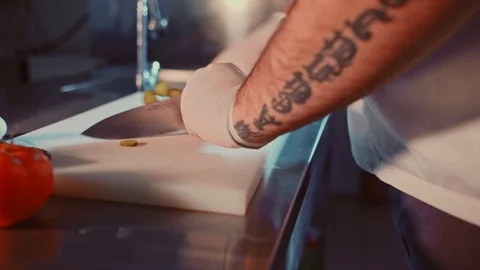 Kitchen chef cutting cucumber with a knife Stock Footage 104195251