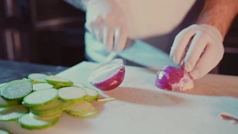 Kitchen chef cutting onion on the cutting board Stock Footage 104196394