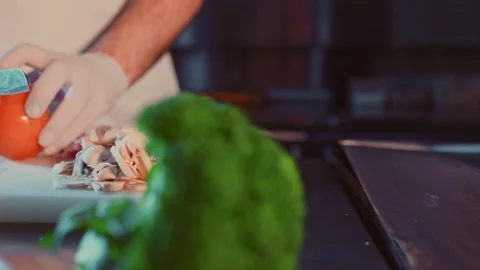 Kitchen chef cutting tomato on the cutting board Stock-Footage 104198300